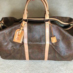 Etro paisley patterned leather duffel bag.